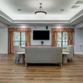 Spacious living room with sofa and TV